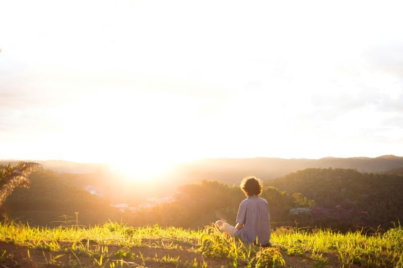man looking at a sunrise