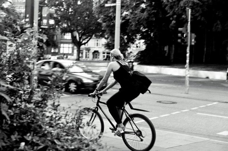 woman riding bike in urban setting