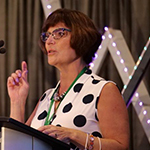 women speaking at a conference