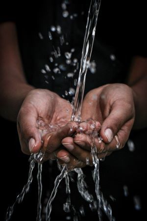 Water pouring into hands