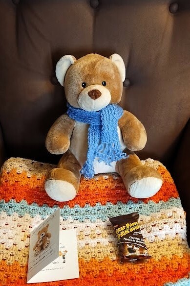 teddy bear with a card and bear paw cookie