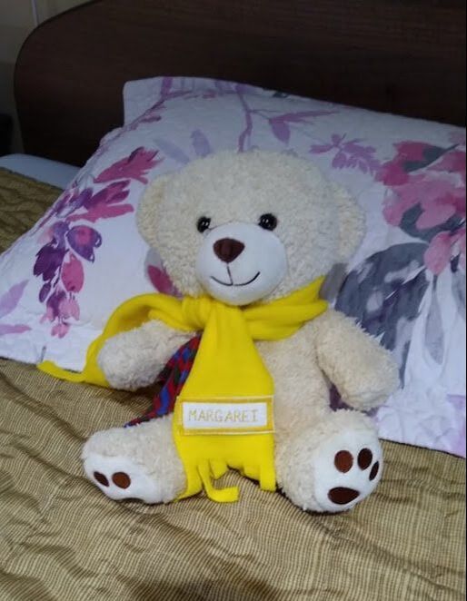 teddy bear with a scarf that says Margaret