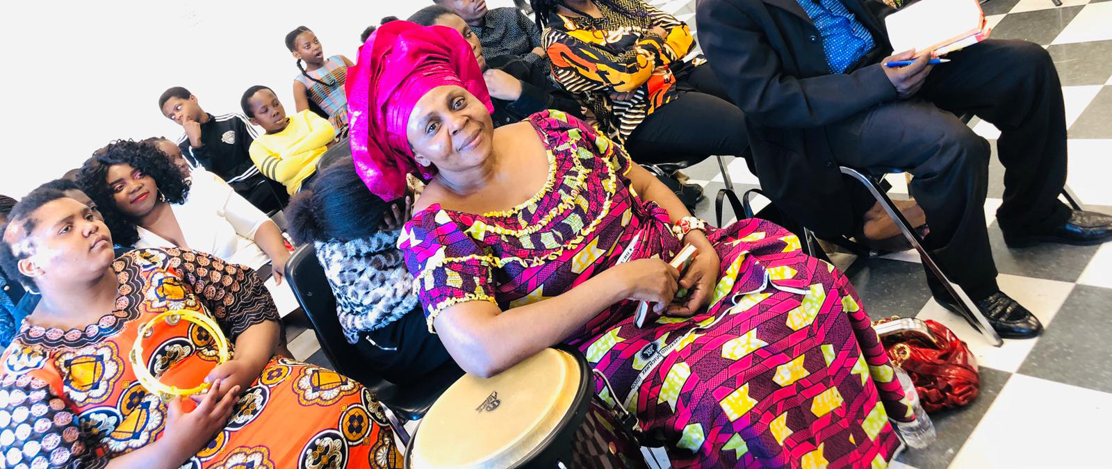 congregation colourfully dressed
