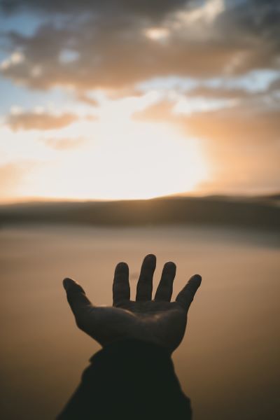 hand raised in prayer