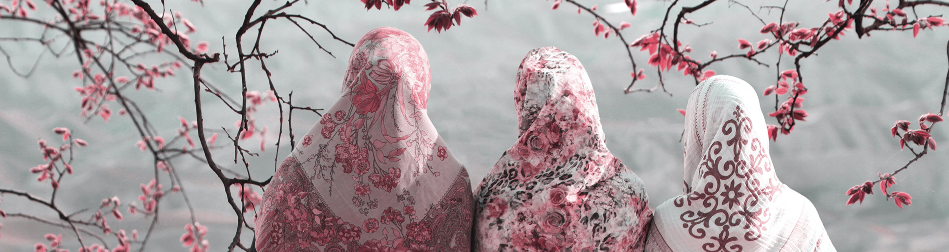 three muslim women looking away