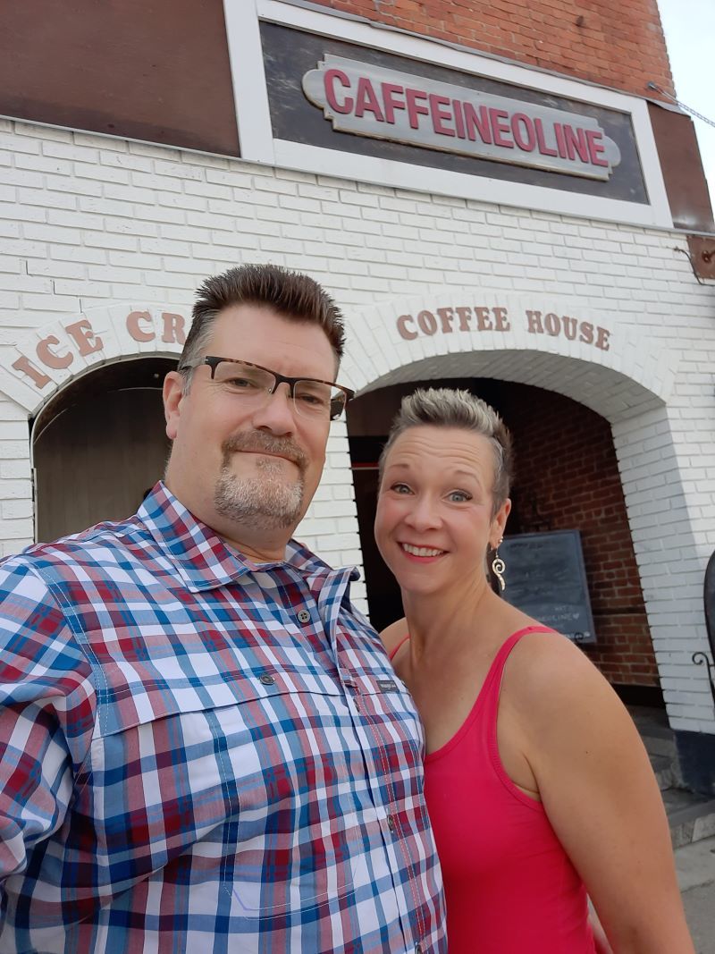 Craig and Kim in front of a coffee shop