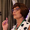 woman speaking at a podium