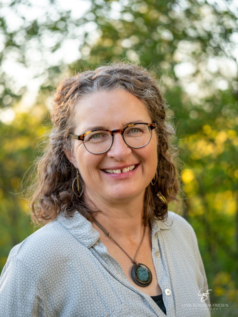 woman with glasses outside close up